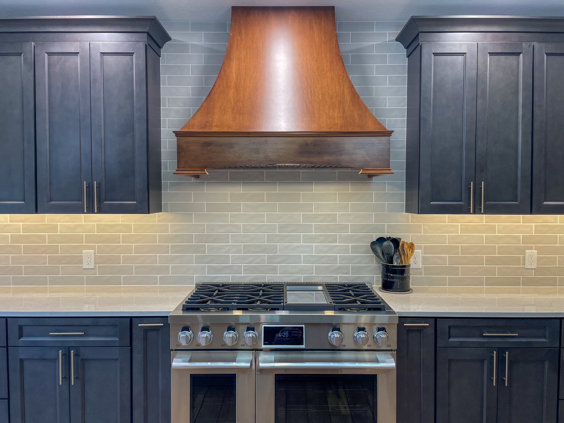 Custom wood range hood kitchen remodel by Marcus Sebastian Renovations
