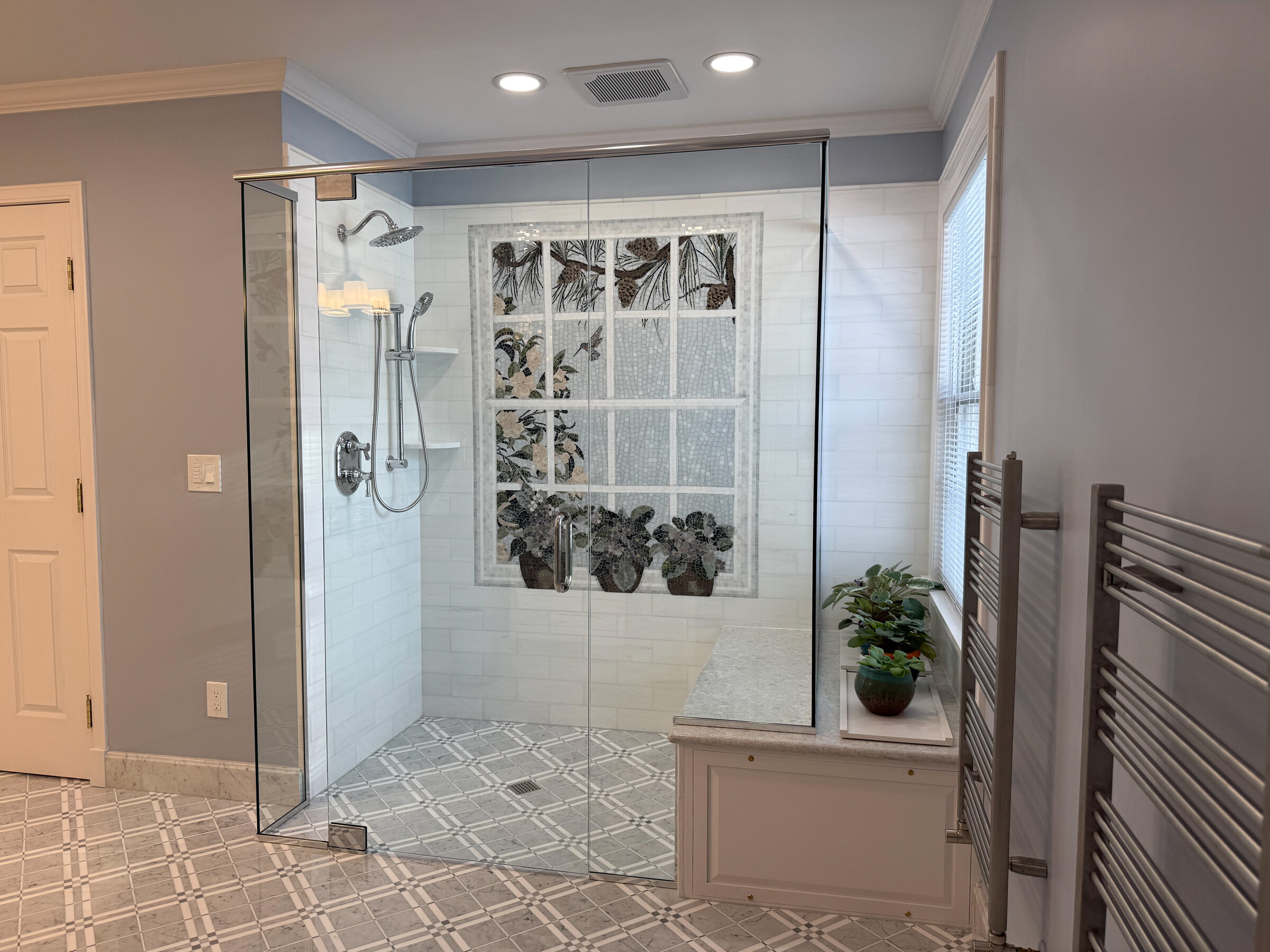 Custom walk-in shower with mosaic tile by Marcus Sebastian Renovations